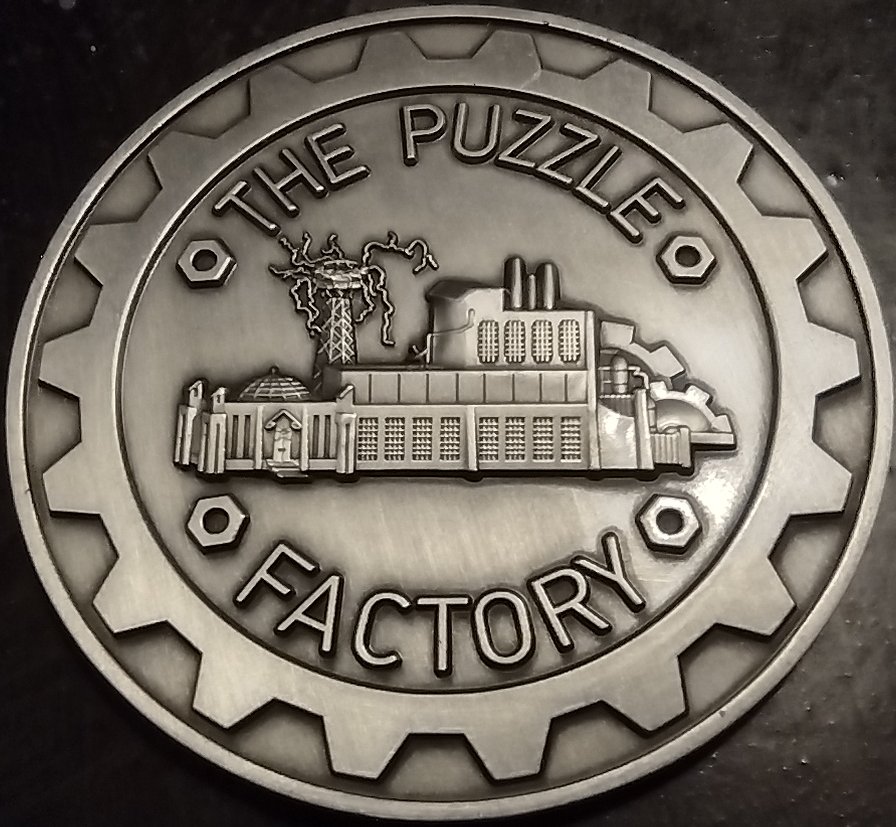 Back of
      the MIT Mystery Hunt 2023 coin, showing the Puzzle Factory